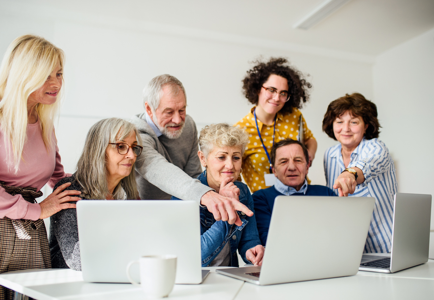 Group of Senior People Using Laptops 